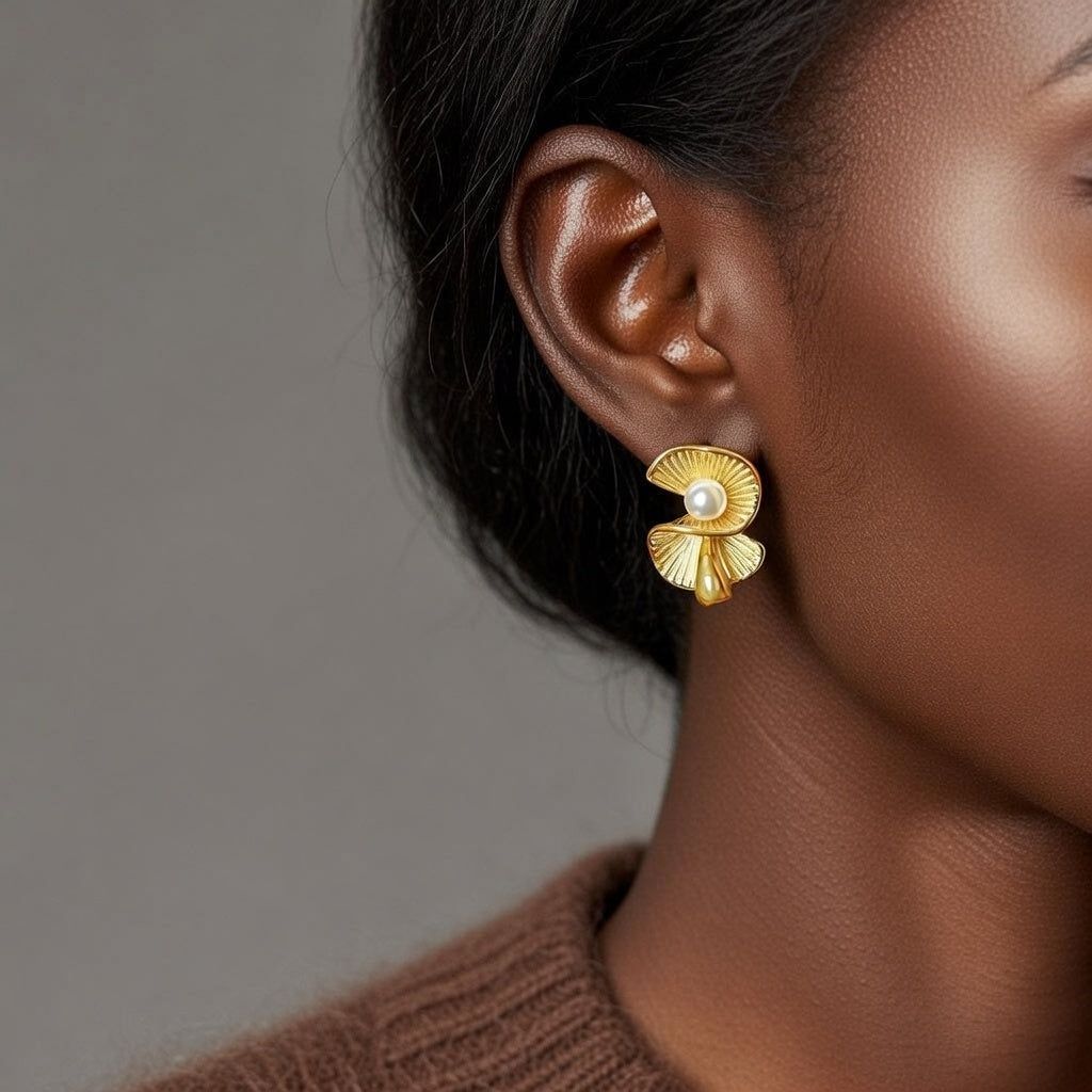 Boucles d’oreilles coquillage doré avec perle