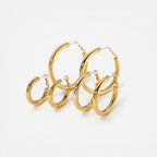 Steel earring plated with fine gold