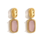 Parure (Collier, bracelet, boucles d'oreilles et bague) en acier inoxydable doré et pierre rose