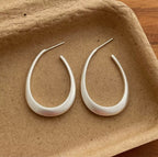 Boucles d'oreilles fantaisie créoles goutte sculpturales
