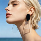 Boucles d’oreilles fantaisie pendantes en résine noire et transparente