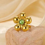 Bague fleur bombée en acier inoxydable avec pierre verte