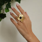 Bague fleur dorée en acier inoxydable avec pierre noire